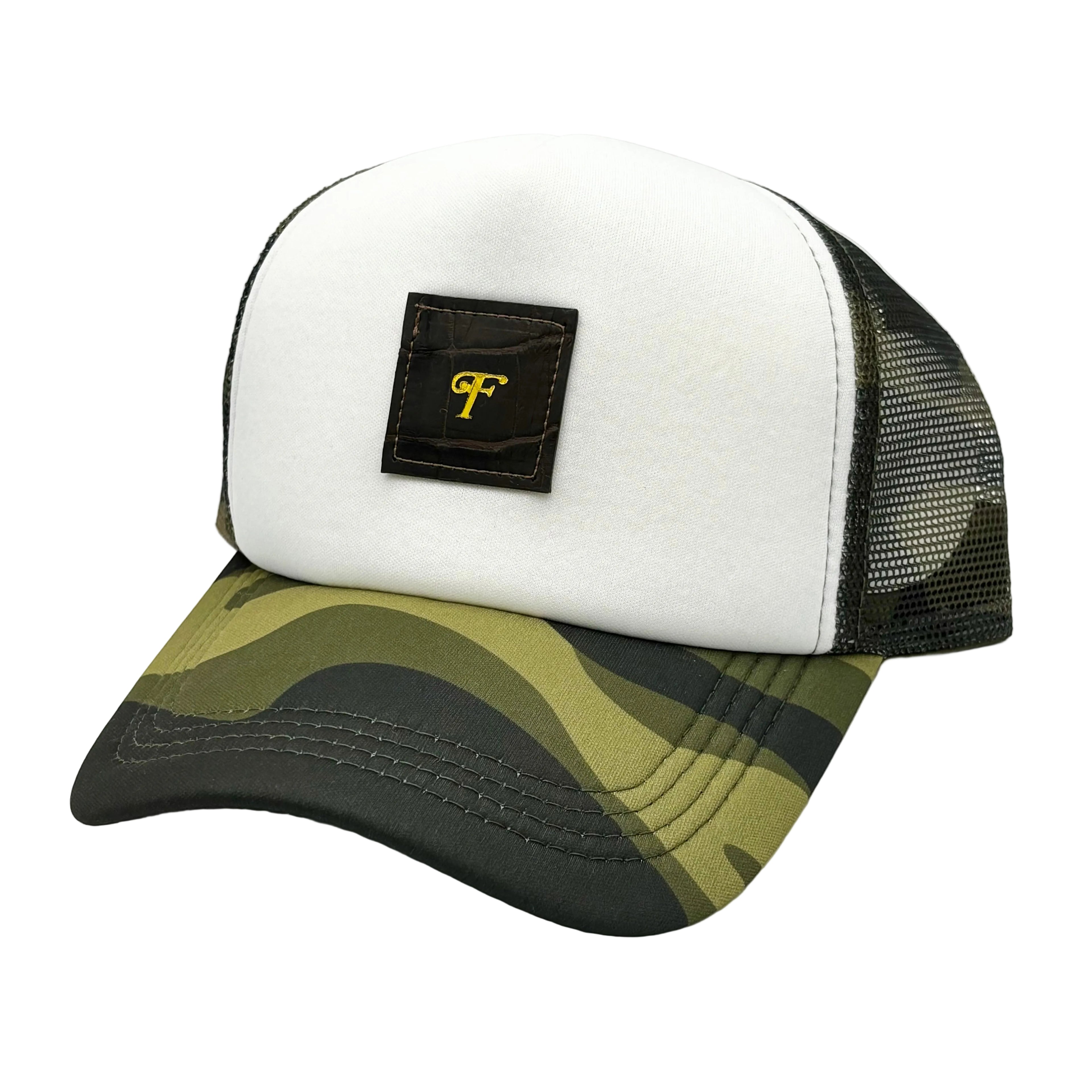 Dark brown alligator camo trucker hat with white front crown, woodland camo brim and mesh, and gold monogram patch