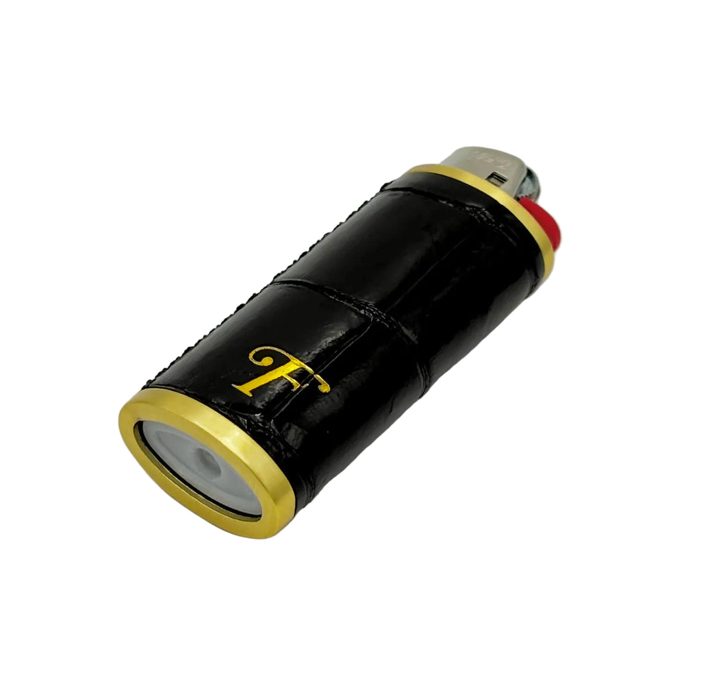 Black alligator hand-stitched lighter sleeve with gold rings and Frostytch monogram on a standard BIC lighter