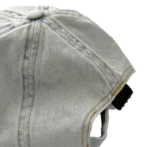 Chocolate brown python leather patch denim hat detail showing washed denim texture and tab back closure