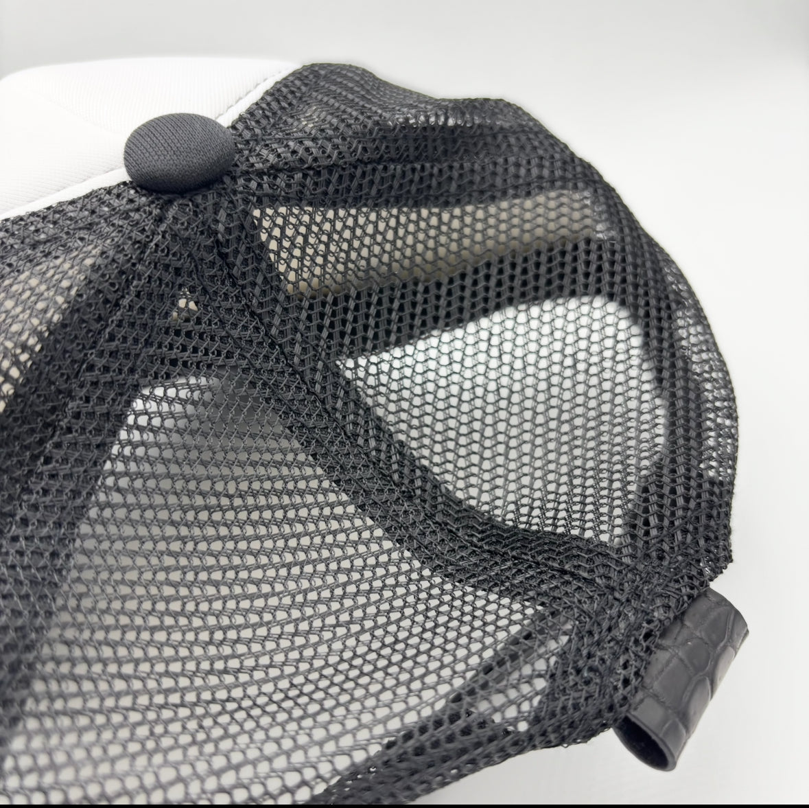 Black and White Nile Crocodile Trucker Hat - rear mesh and crocodile leather tab detail