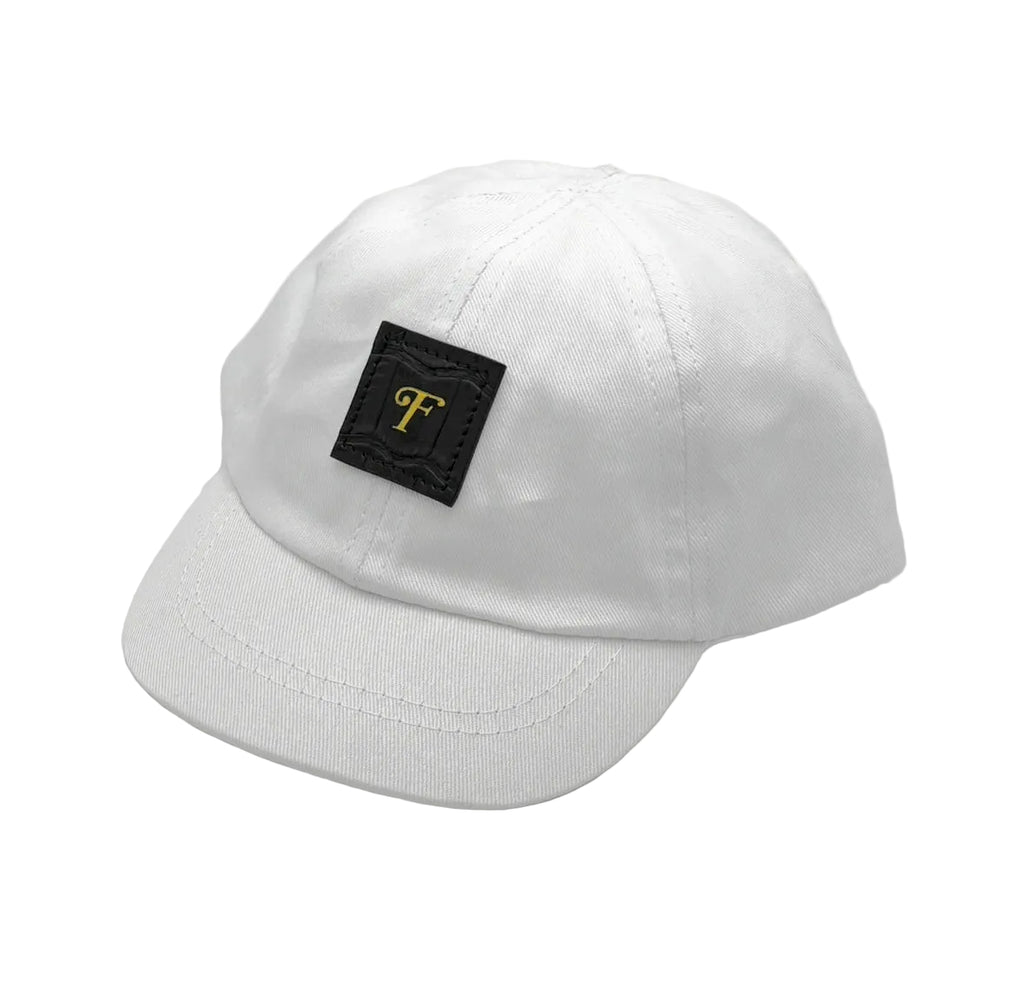 Matte black Nile crocodile infant baby cap with gold Frostytch monogram patch and elastic scrunchie back, lined with Italian black Saffiano leather