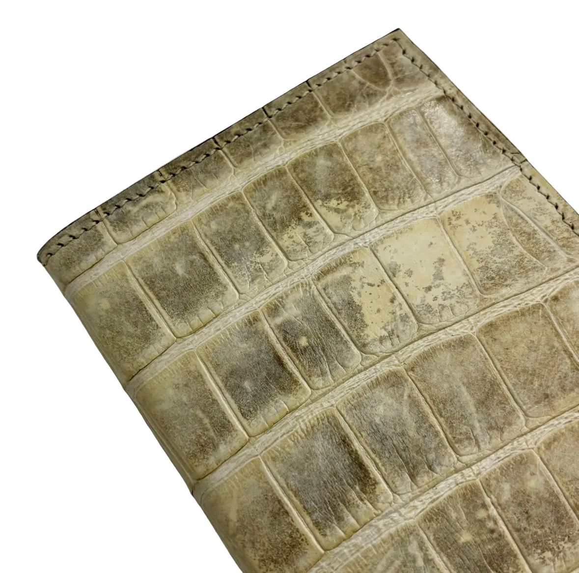 Glazed natural alligator passport cover — angled view showing dark brown saffiano interior lining