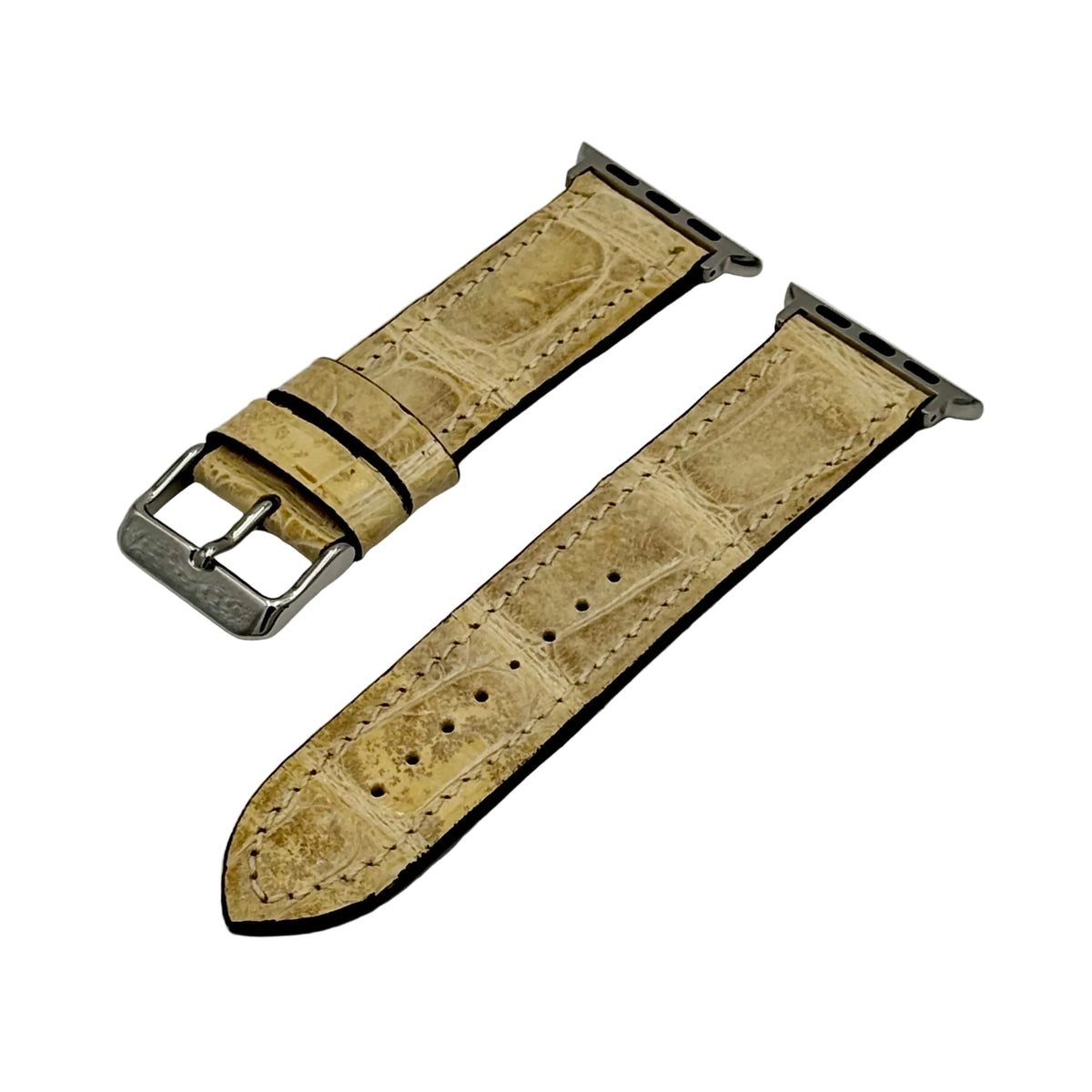 Glazed natural alligator Apple Watch band with silver polished buckle and adapter hardware — both pieces laid flat